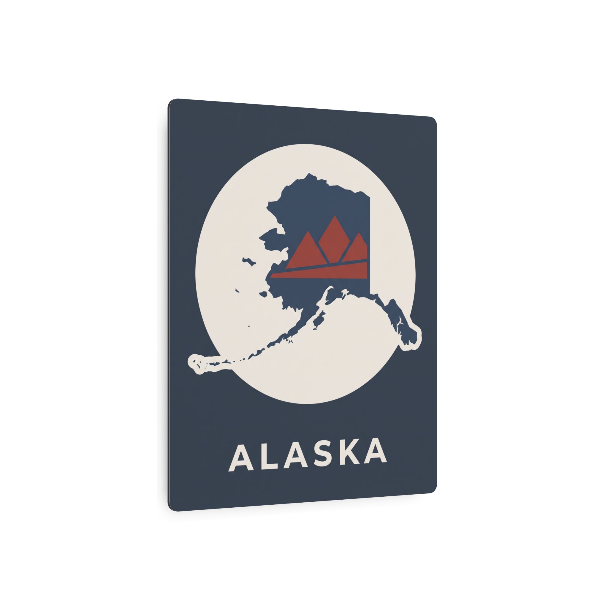 Alaska metal wall sign in dark blue with circular map, red mountains, and ALASKA wordmark