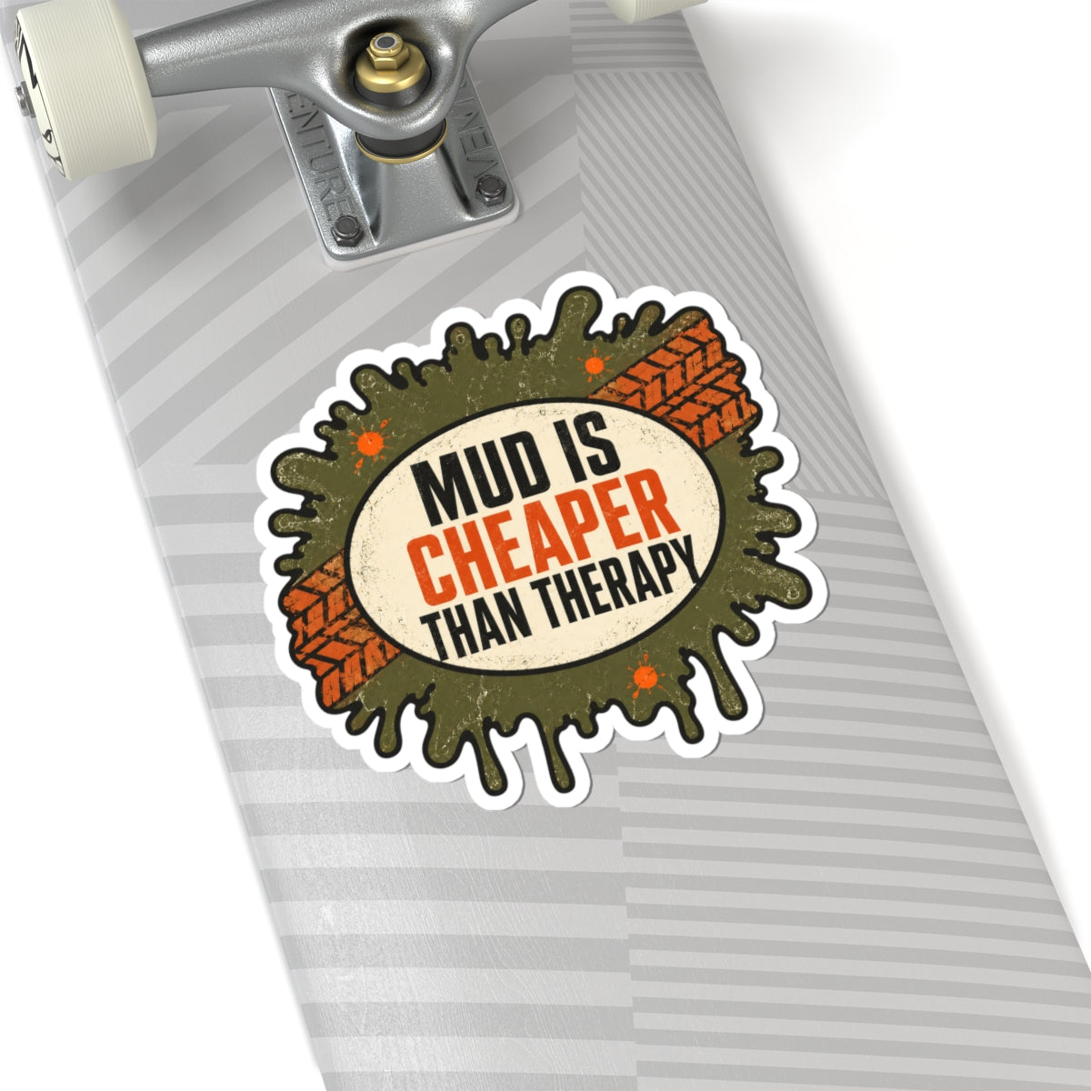 Die-cut sticker with muddy splash center, orange track pattern, and “Mud Is Cheaper Than Therapy”.