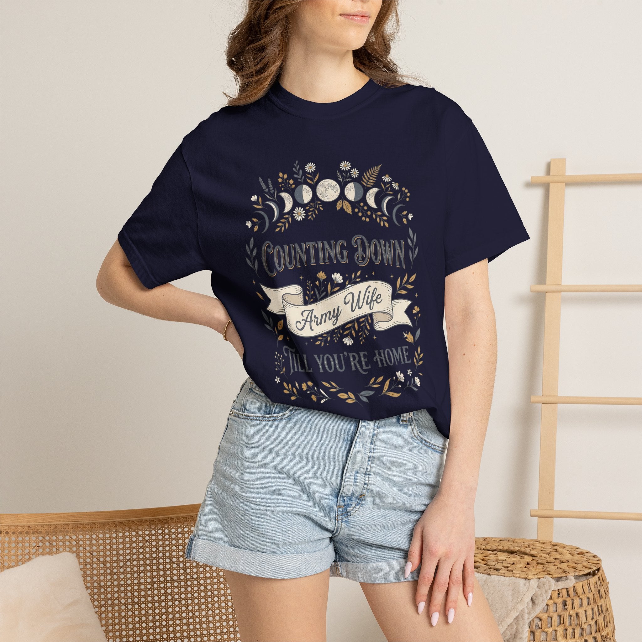 Navy T-shirt with 'Counting Down' crescent floral graphic, worn by model.