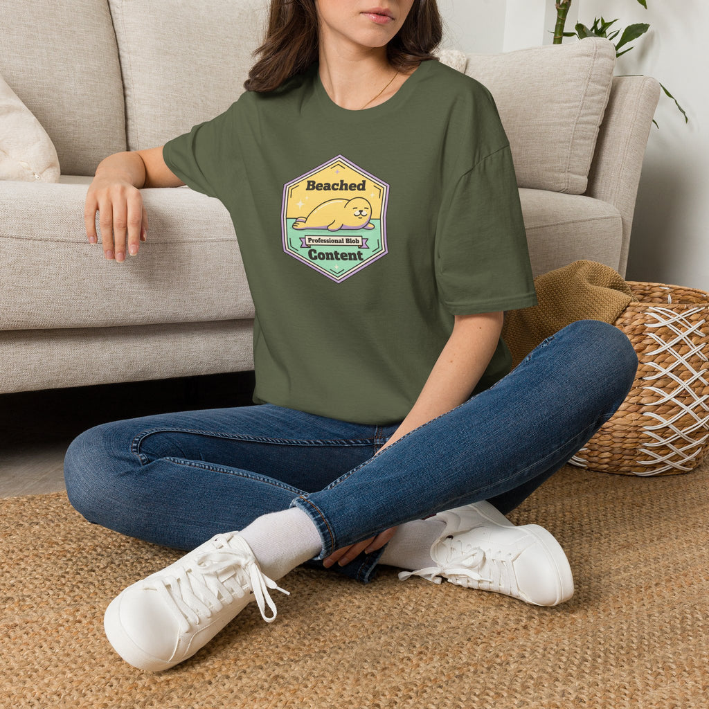 Olive green T-shirt with chest seal badge graphic and short sleeves
