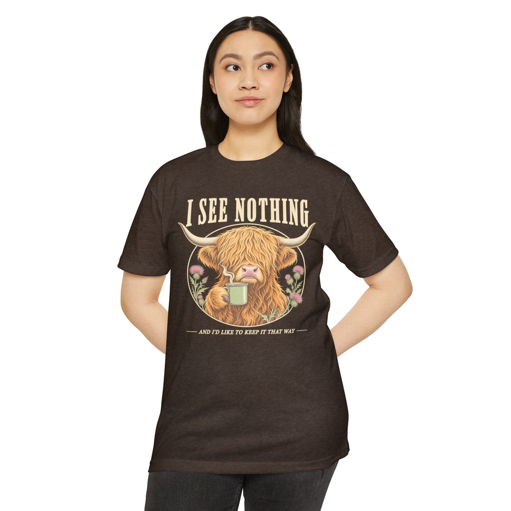 Brown t-shirt with Highland cow mug graphic and “I see nothing” slogan, front