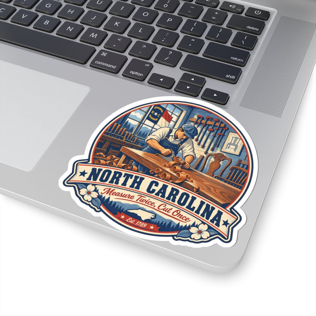 North Carolina woodworker state pride sticker on laptop lid, carpenter carving scene badge