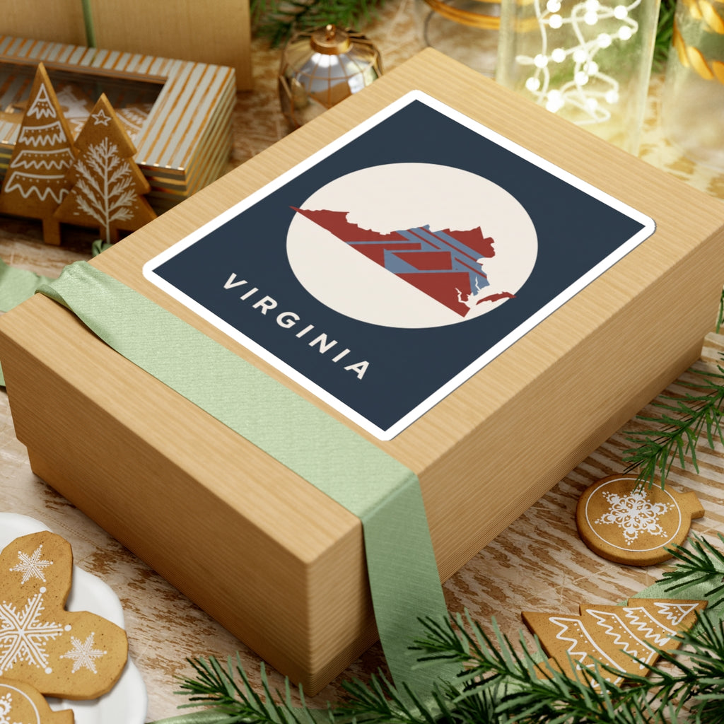 Virginia map sticker on wrapped gift: dark blue square label with cream circle and VIRGINIA text