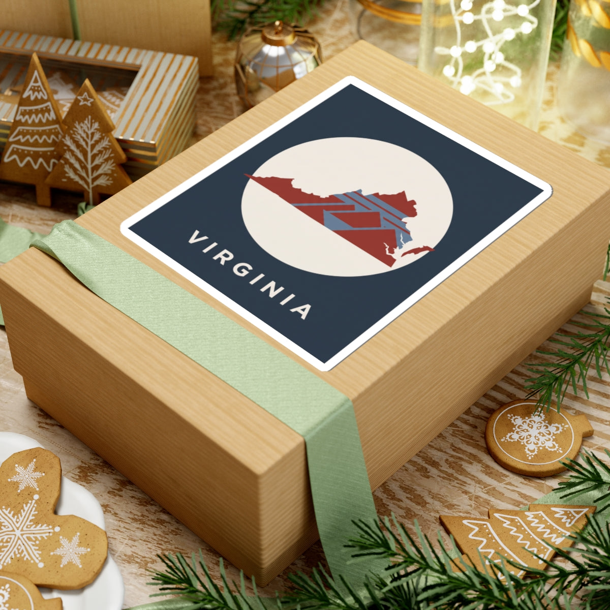 Virginia map sticker on wrapped gift: dark blue square label with cream circle and VIRGINIA text