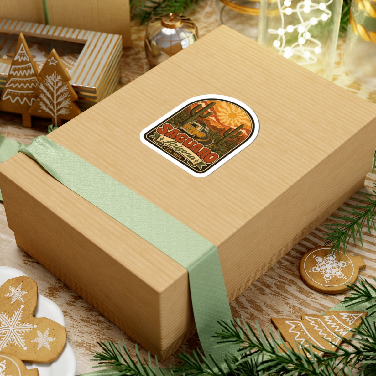 Saguaro Arizona kiss-cut sticker on a wrapped gift box with cactus artwork and Est. 1994