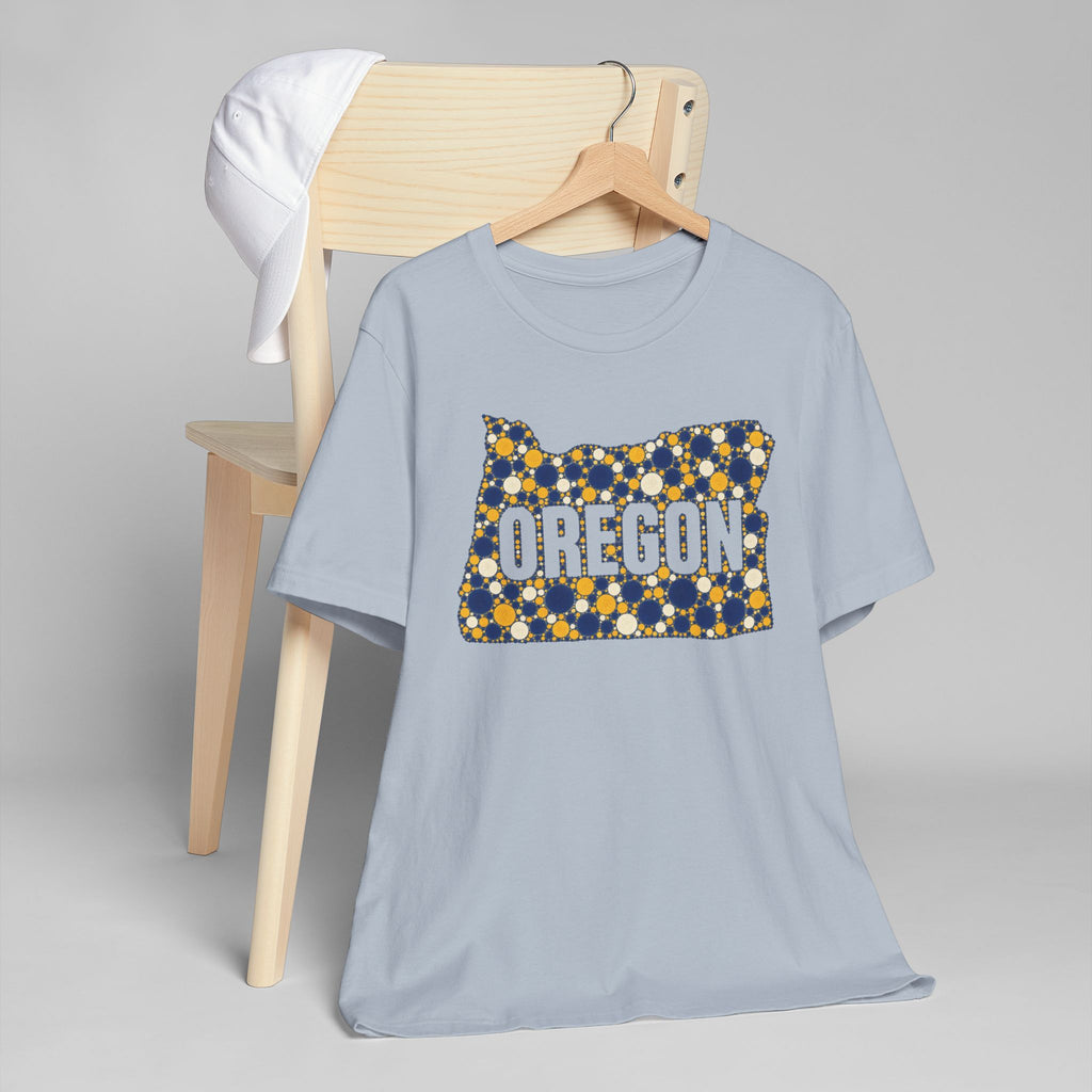 Light blue crew-neck T-shirt with Oregon graphic in blue and gold dots.