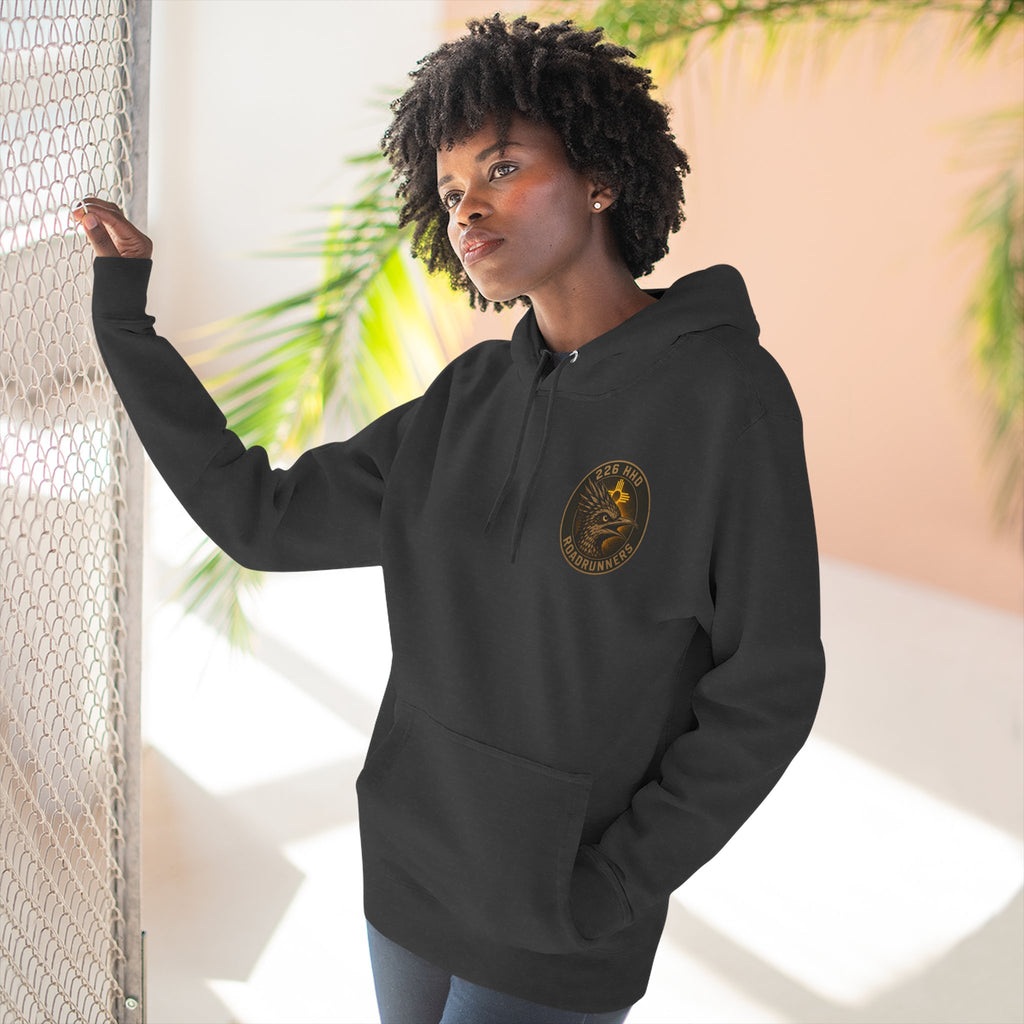 Black pullover hoodie with hood, drawstrings, and chest logo patch