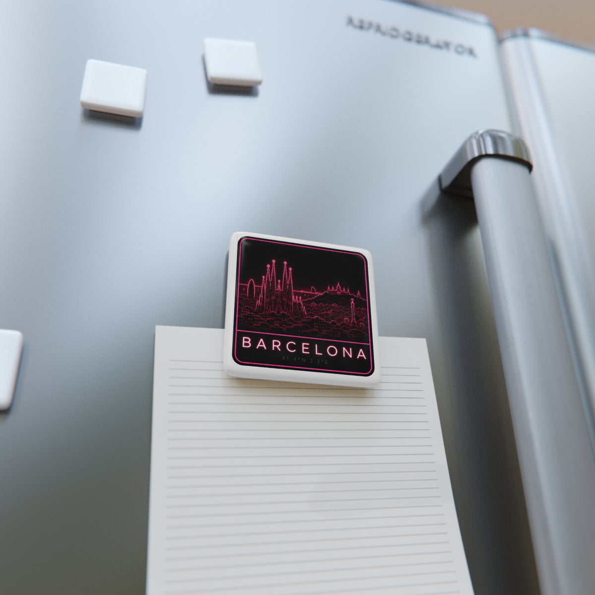 Square porcelain fridge magnet on lined paper with neon pink Barcelona skyline and BARCELONA