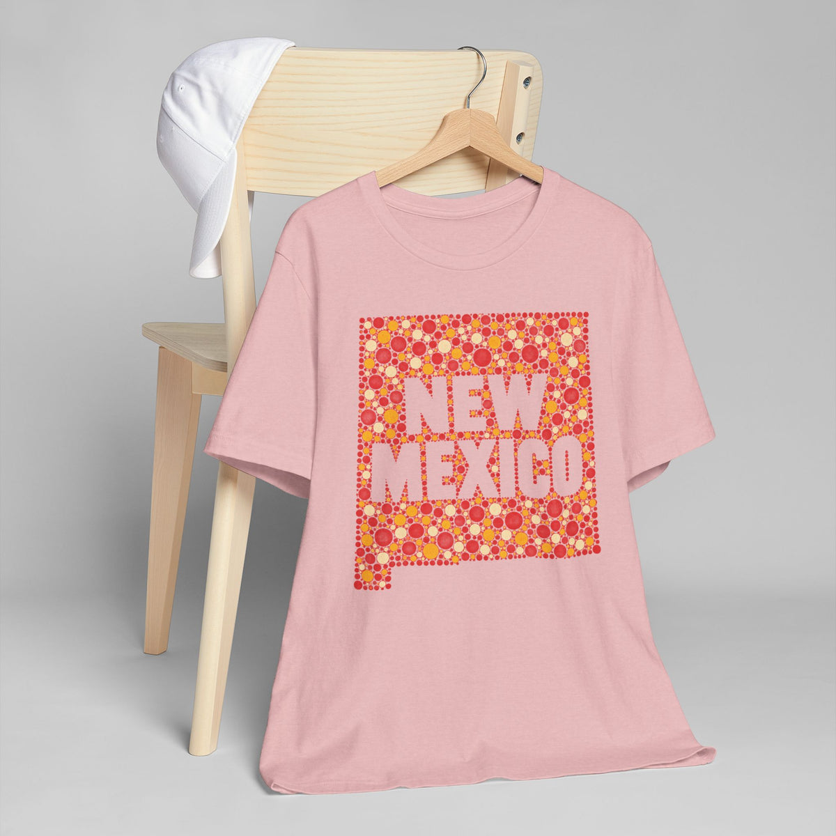 Pink crew-neck T-shirt with red and orange New Mexico graphic print
