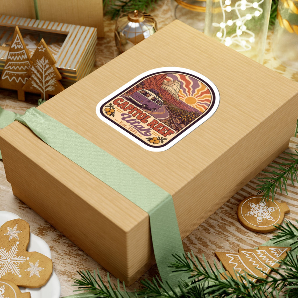 Kiss-cut sticker with desert landscape, sun over hills, and Capitol Reef Utah est. 1971 text.