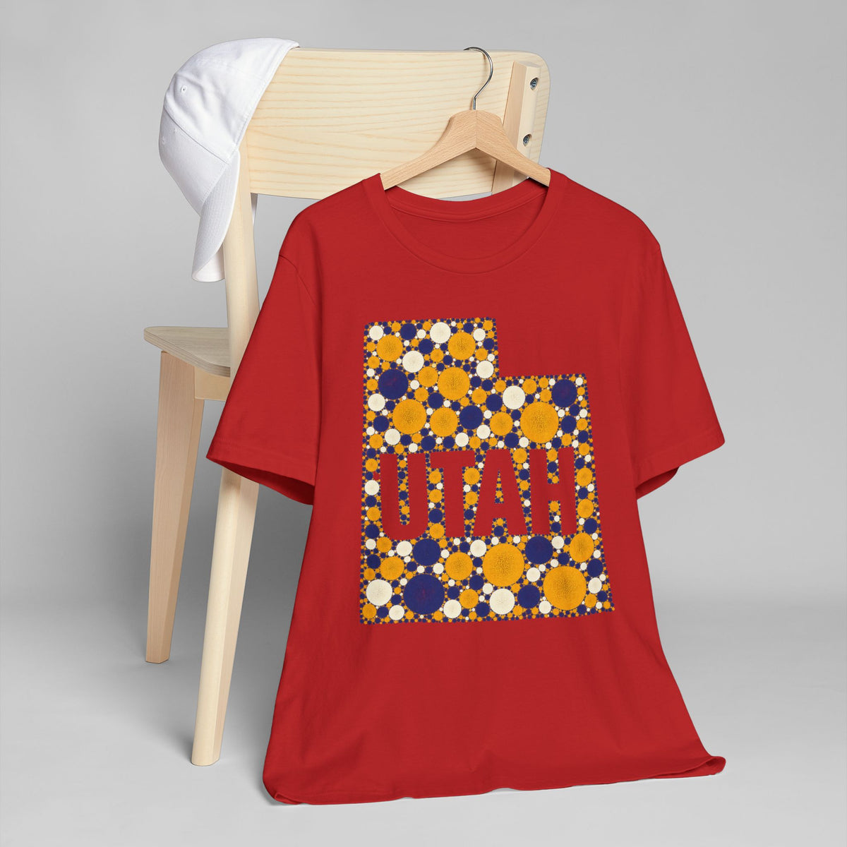 Red T-shirt with large polka-dot state graphic print.