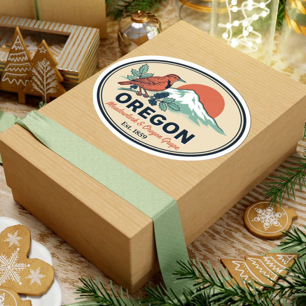 Oregon badge decal on a gift box with meadowlark, mountain scene, grape vine, Est. 1859.