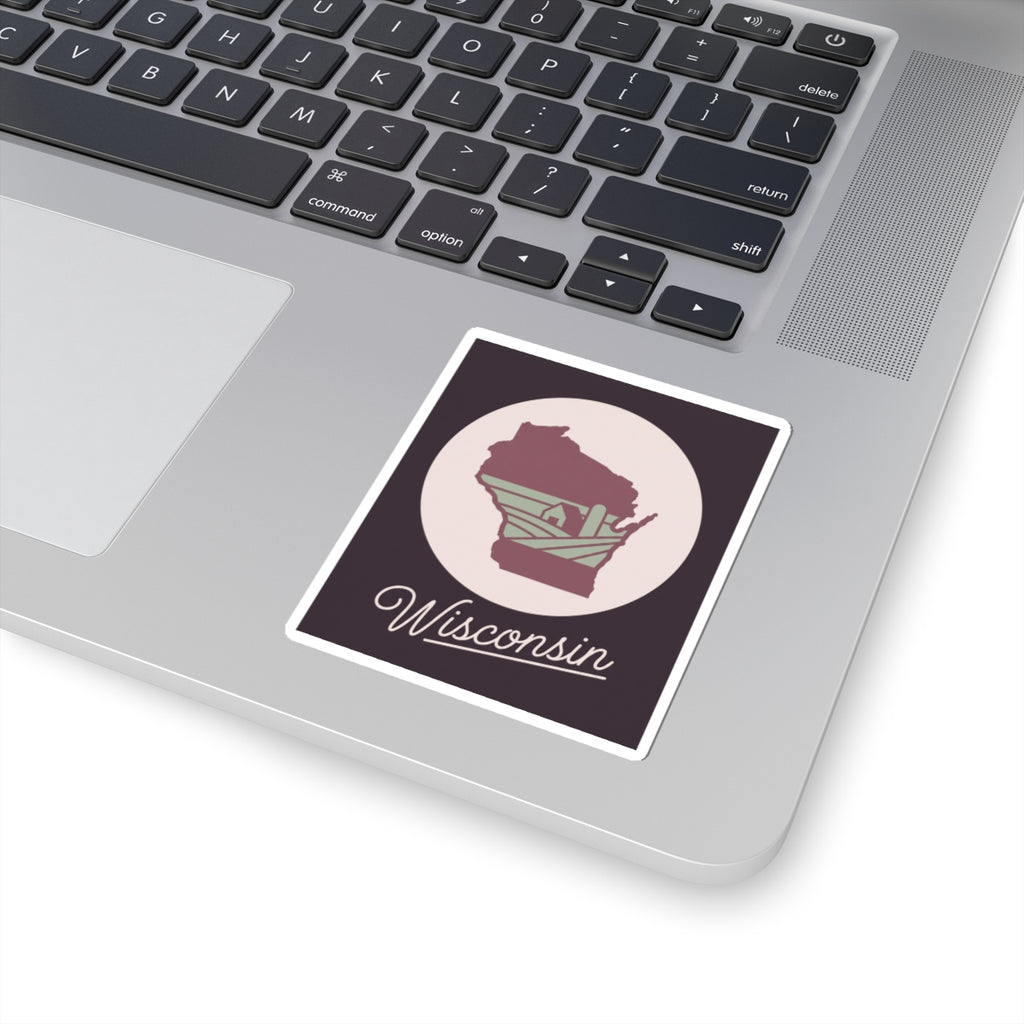 Wisconsin sticker decal on a laptop surface: maroon state silhouette and “Wisconsin”