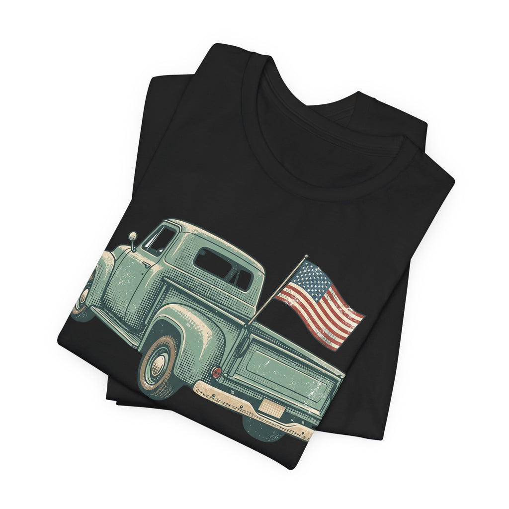 Black T-shirt with green vintage pickup truck and U.S. flag graphic on front
