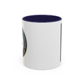 White coffee mug with navy rim, showing side view with partial printed design panel.