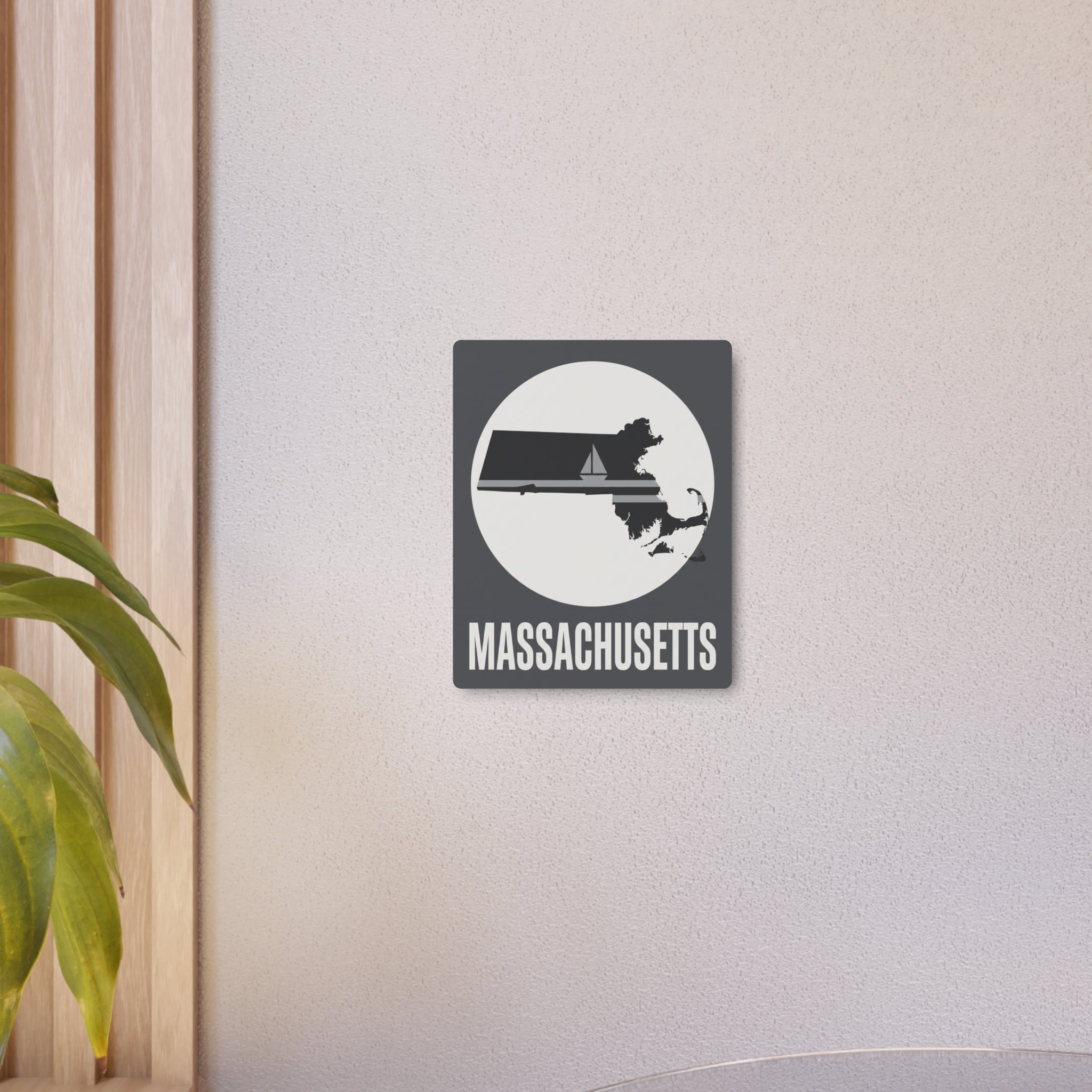 Massachusetts nautical sailboat metal wall art sign mounted on an off-white wall