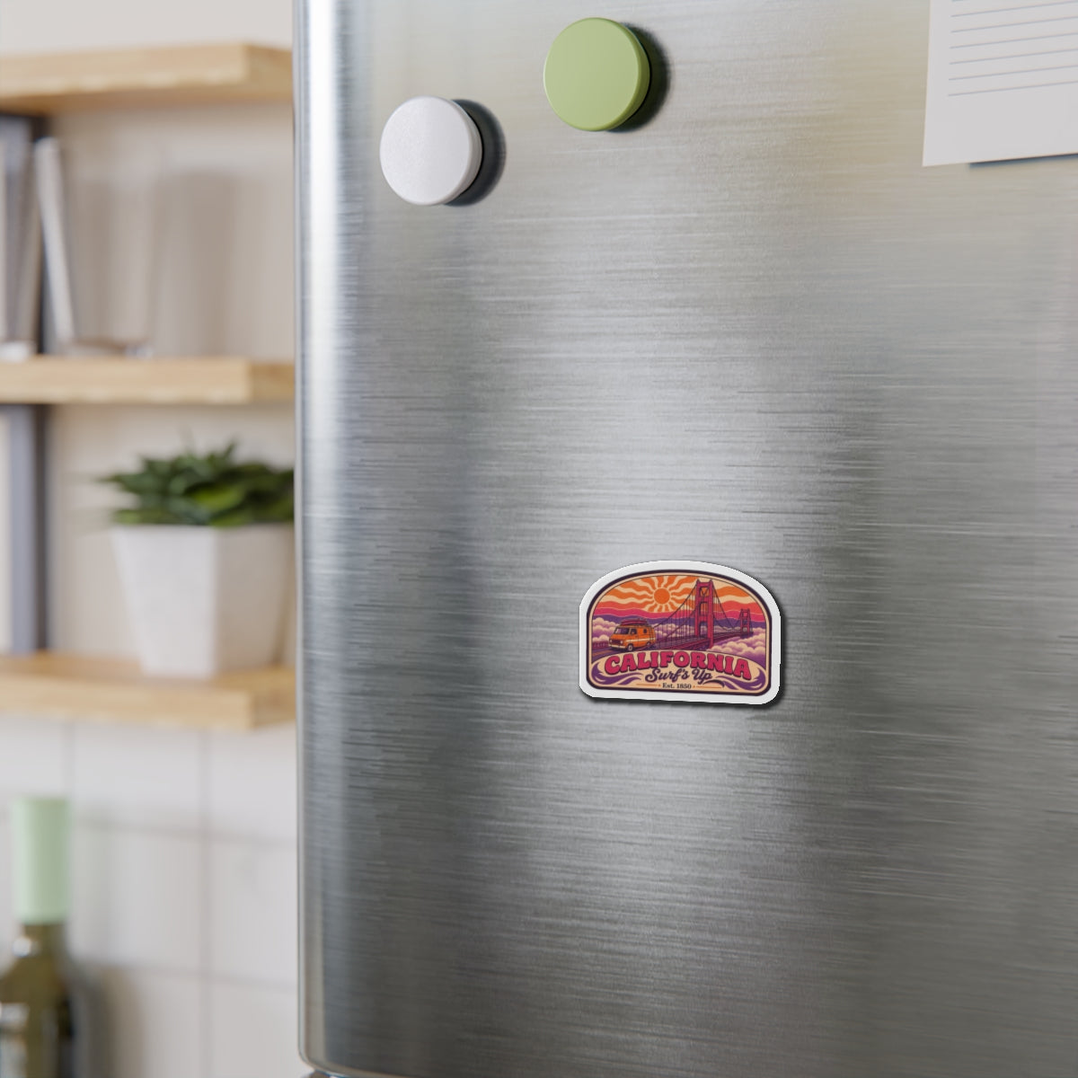 California die-cut magnet on brushed metal surface; retro Golden Gate bridge and van