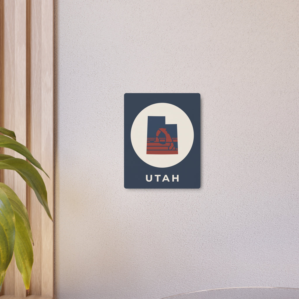 Small Utah metal art sign featuring oval emblem, retro arch artwork, and UTAH text