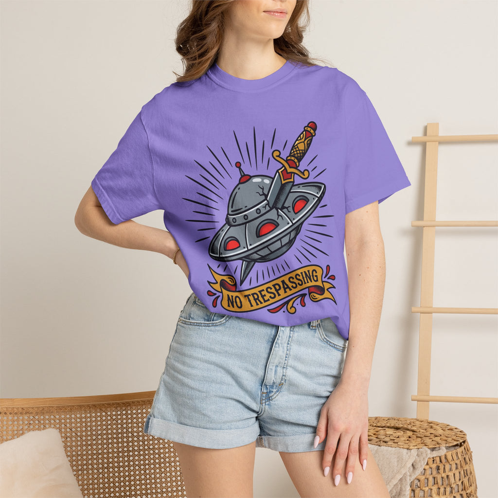 Purple T-shirt with retro UFO dagger graphic and “NO TRESPASSING” text on front