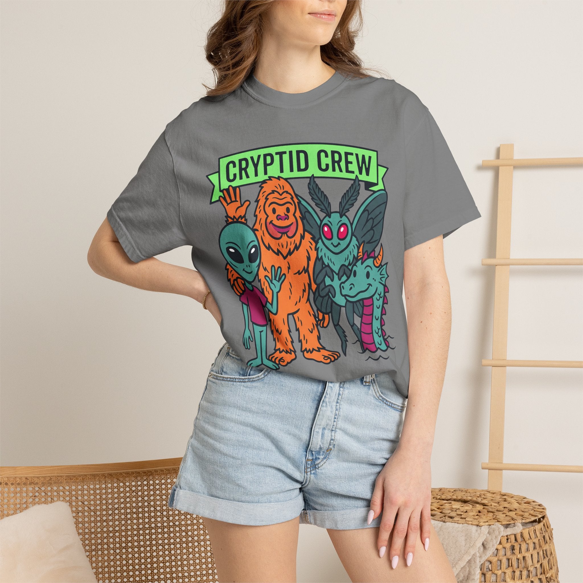 Dark gray crew-neck T-shirt with colorful “Cryptid Crew” graphic of four alien cryptids