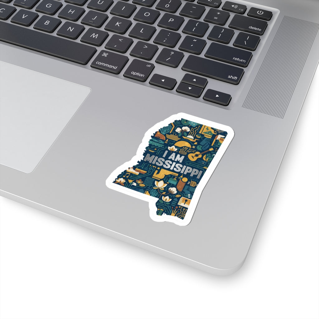 “I AM MISSISSIPPI” sticker on laptop, dark blue circuit-and-flower design, white outline