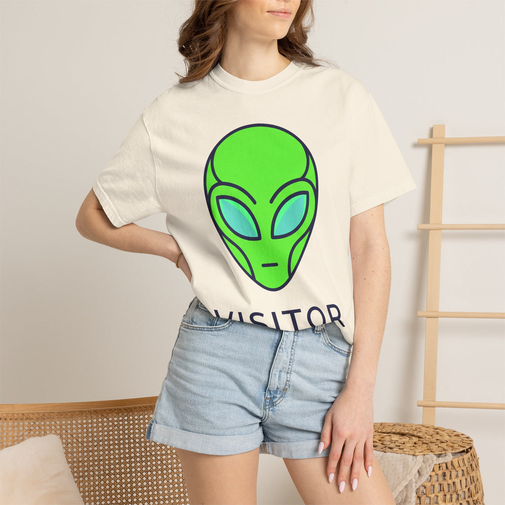 Alien face graphic T-shirt in ivory/cream with neon green and blue print, worn