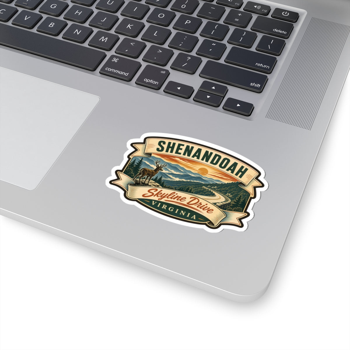 Shenandoah sticker on laptop lid, featuring deer, mountains, Skyline Drive, and Virginia