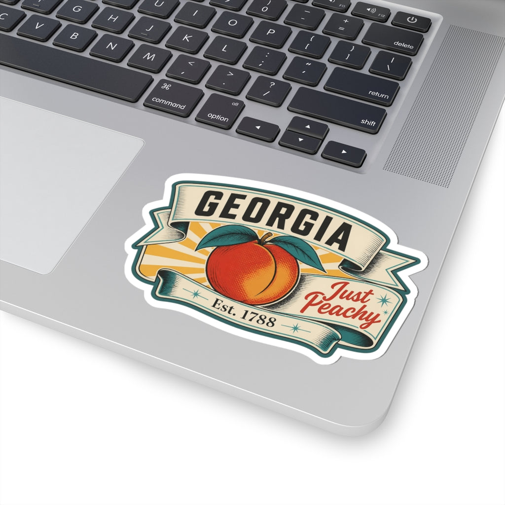 Georgia state emblem sticker with peach and “Est. 1788” on a laptop lid