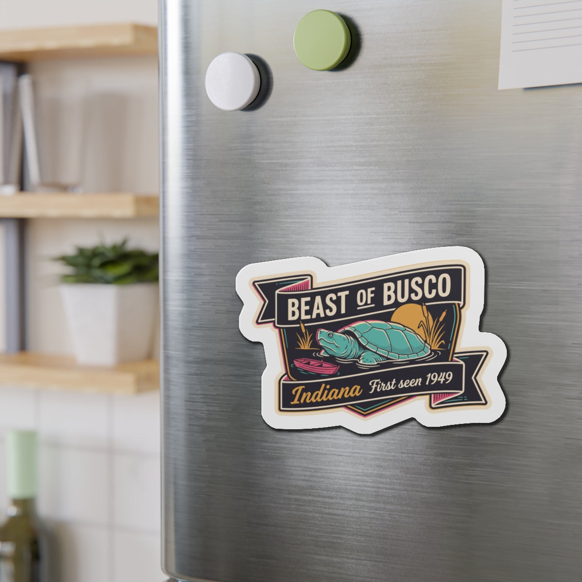 Die-cut turtle emblem magnet sticker on stainless steel fridge surface