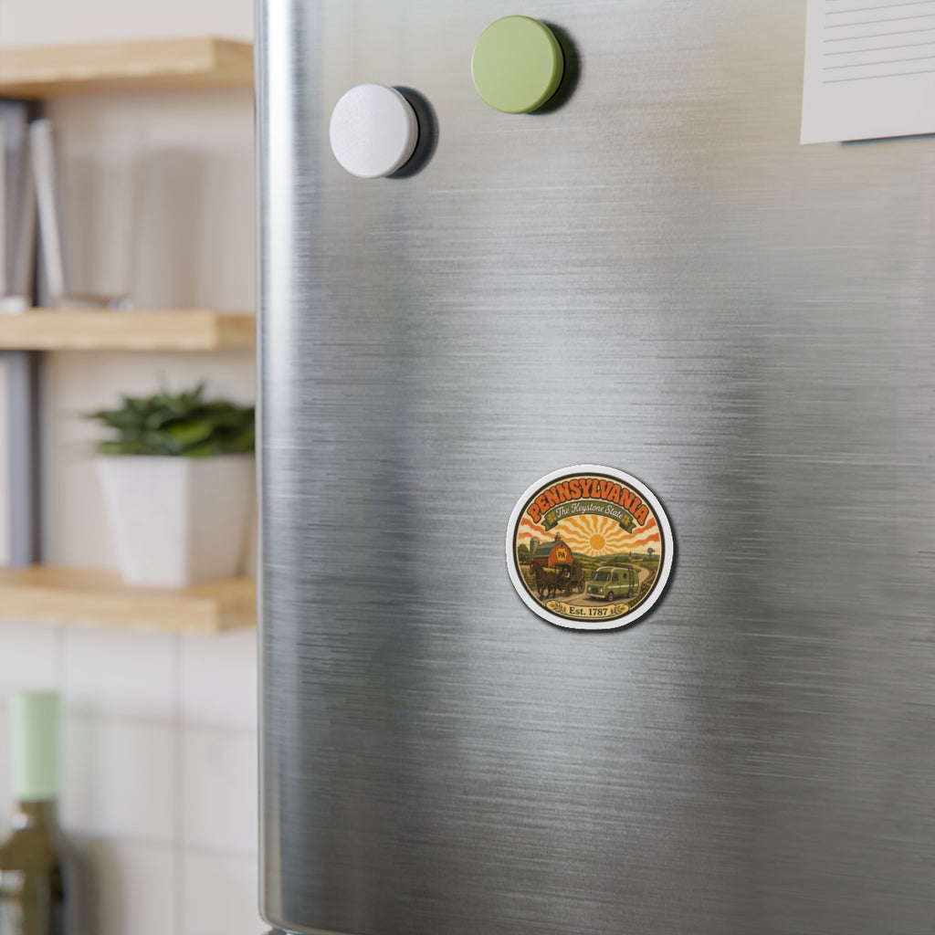 Pennsylvania round magnet on stainless refrigerator, showing 'Est. 1787' farm artwork.