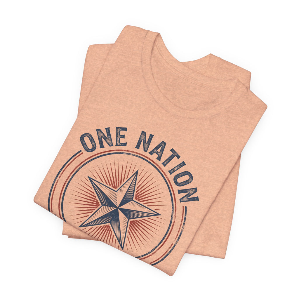 Peach t-shirt with patriotic star graphic in a circular emblem and curved text.