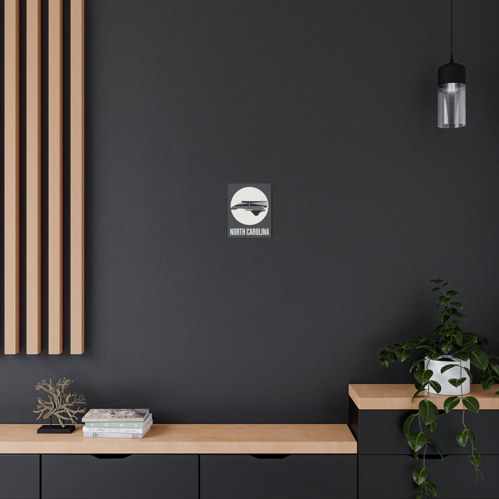 North Carolina lighthouse metal wall sign on dark wall above console, small centered piece