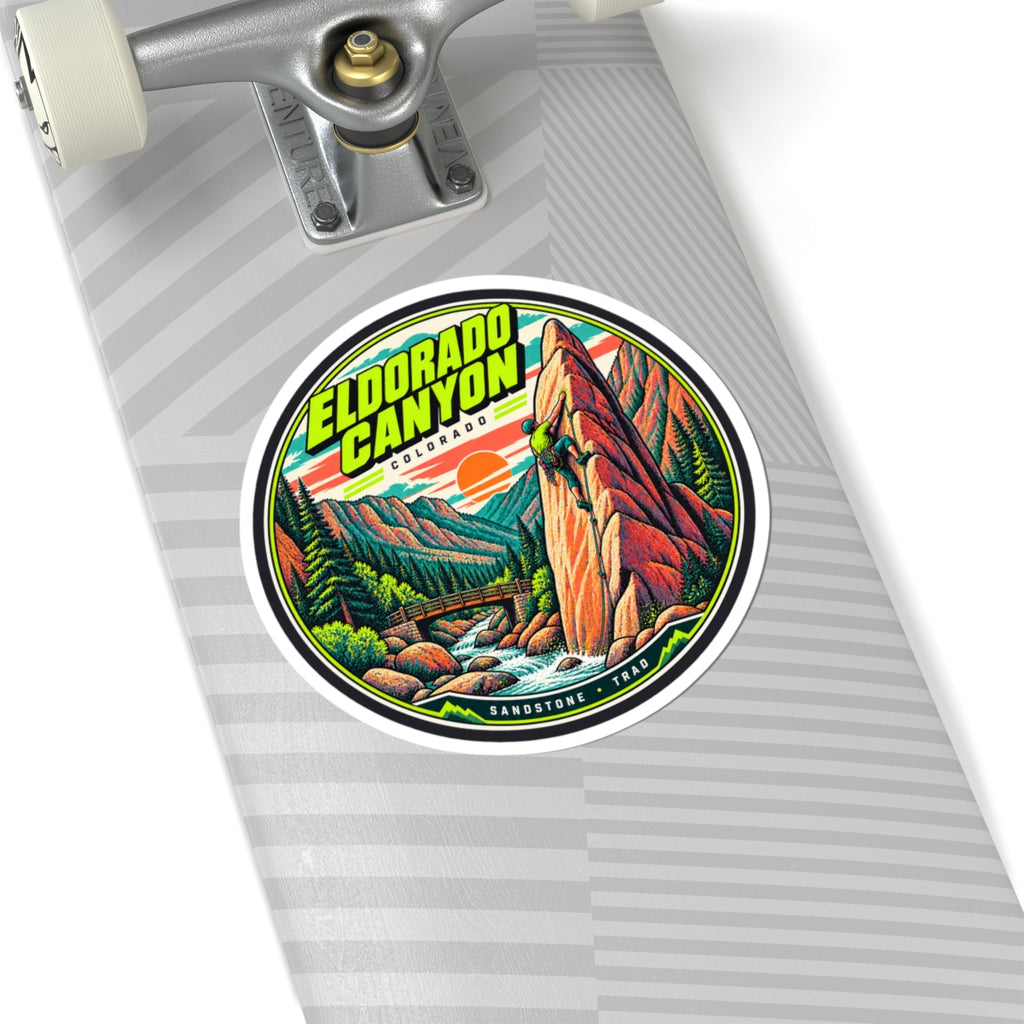 Round vinyl climbing sticker on striped background with canyon landscape, climber, and 'Eldorado Canyon'.