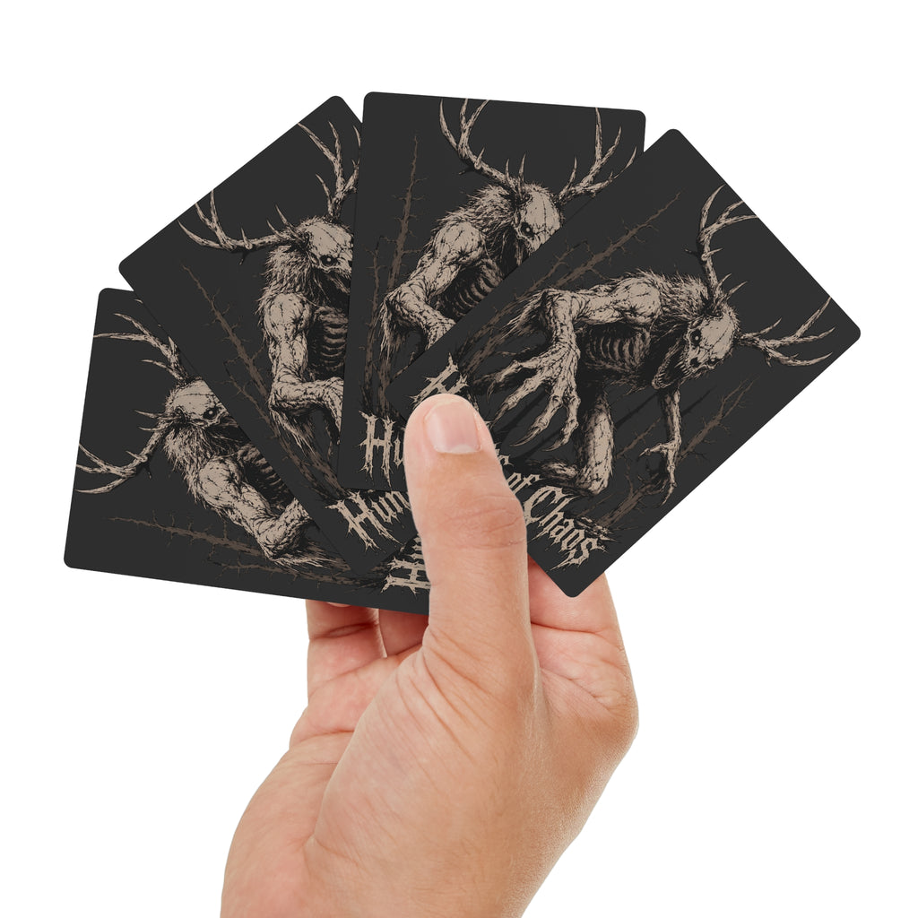 Hand holding Hunters of Chaos poker cards with antlered skull backs