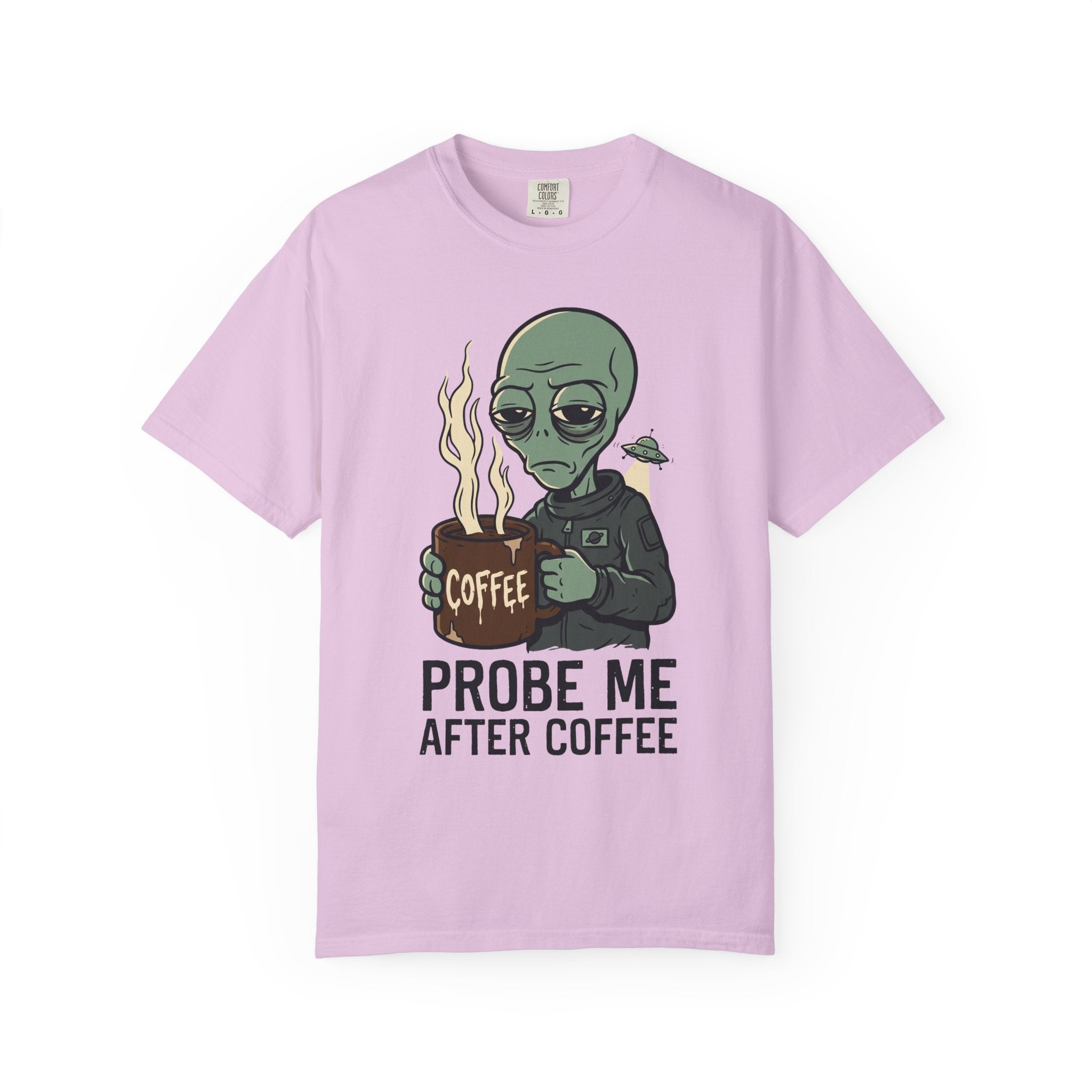 Light pink T-shirt with green alien holding a coffee mug and “PROBE ME AFTER COFFEE” print