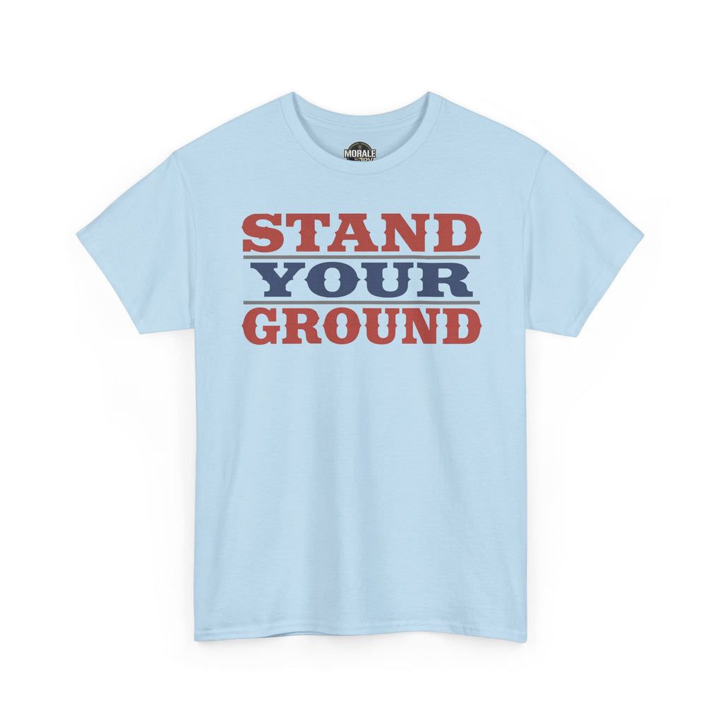 Light blue T-shirt with bold vintage “STAND YOUR GROUND” text graphic on front
