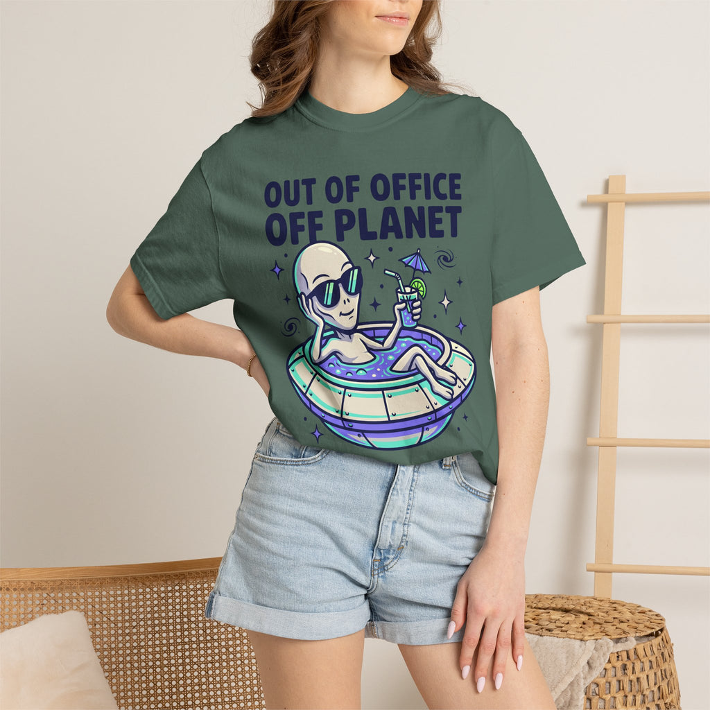 Green T-shirt worn by model with “Out of Office Off Planet” alien floatie graphic