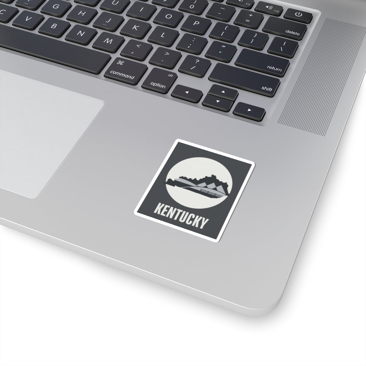 Kentucky state vinyl sticker with black landscape silhouette and white border