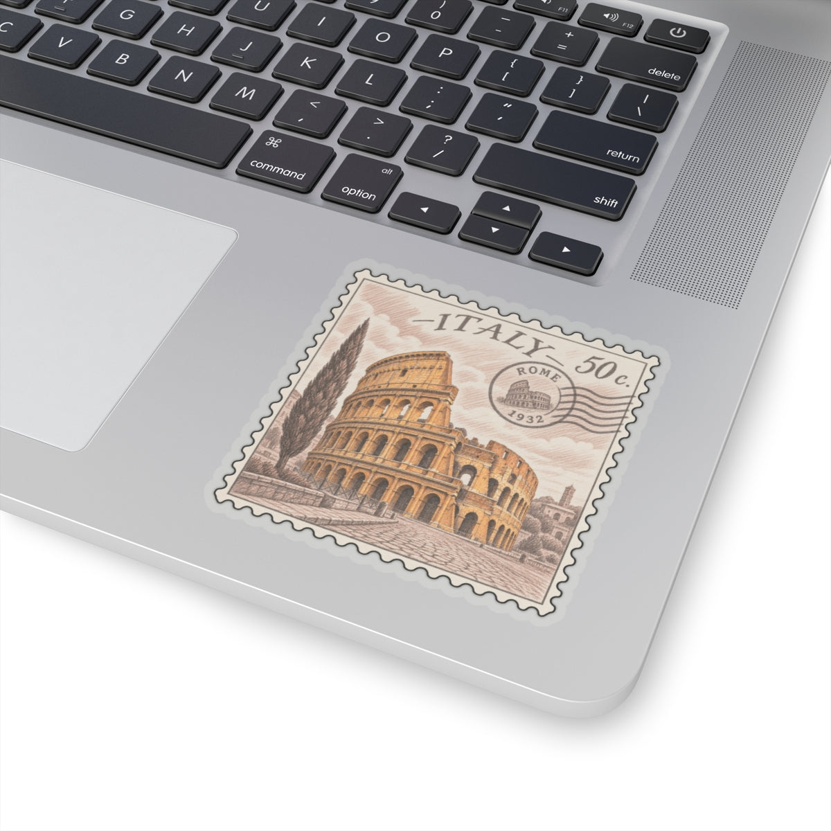 Kiss-cut Italy stamp sticker on a laptop, with Colosseum illustration and “ITALY 50c”