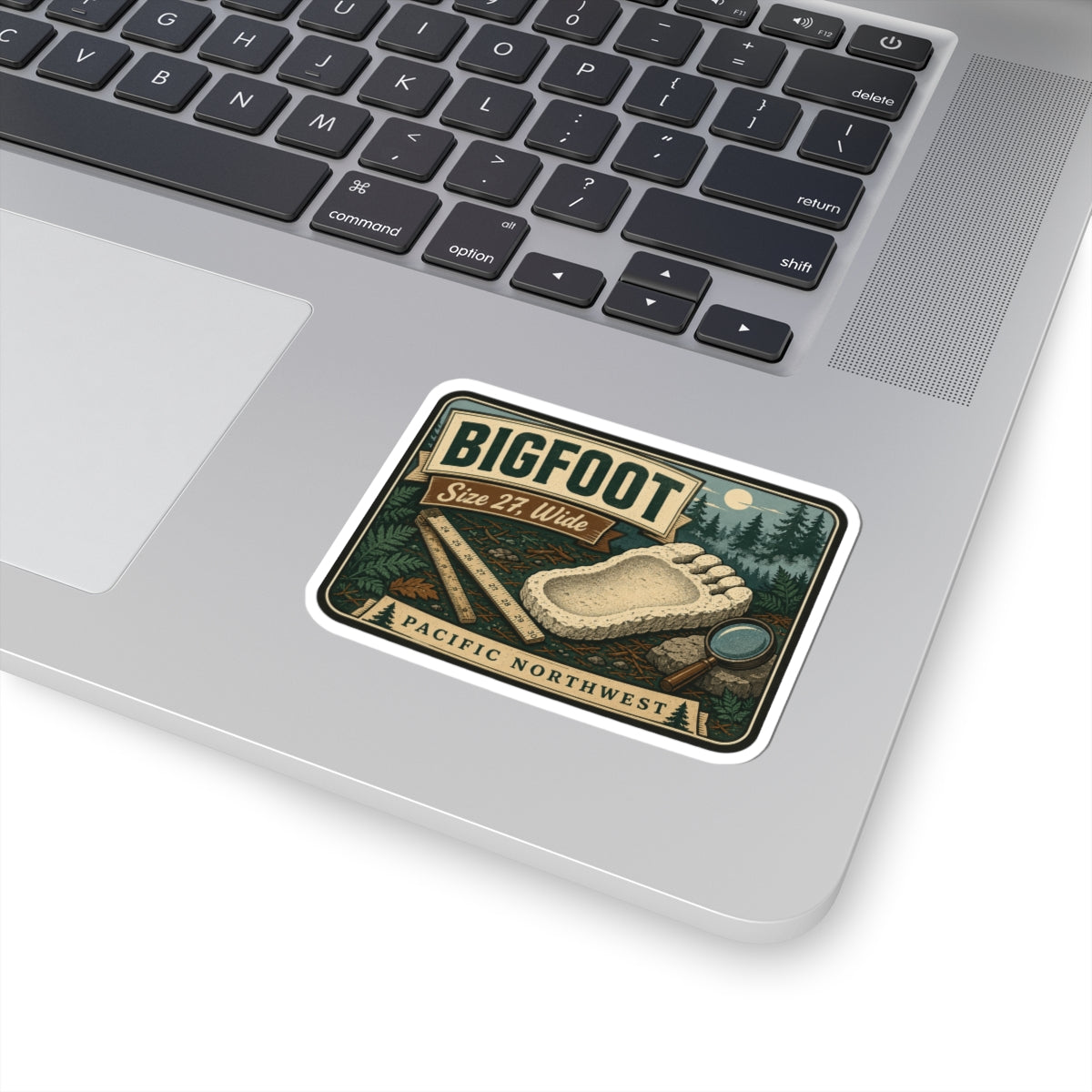 Bigfoot footprint sticker decal with thick white outline, retro forest camping scene