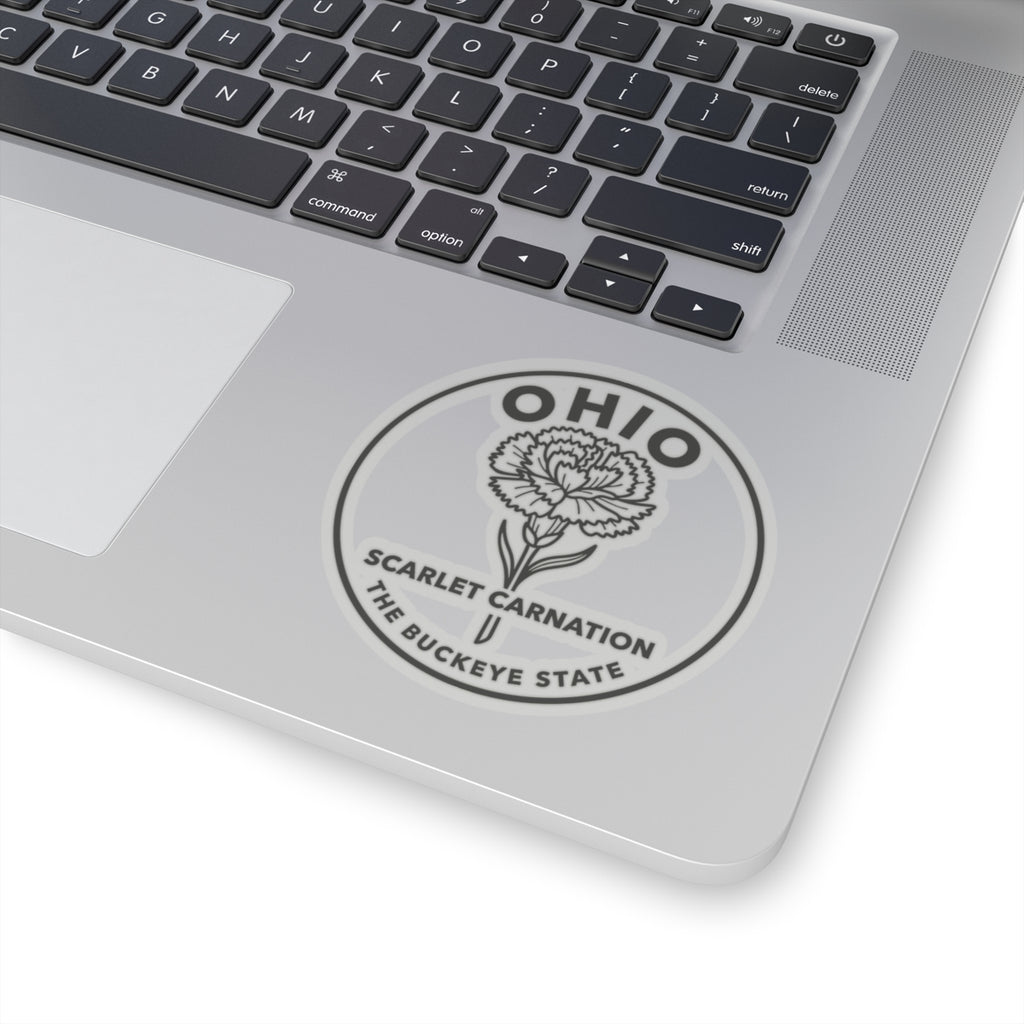 Round Ohio state flower decal on laptop lid near keyboard