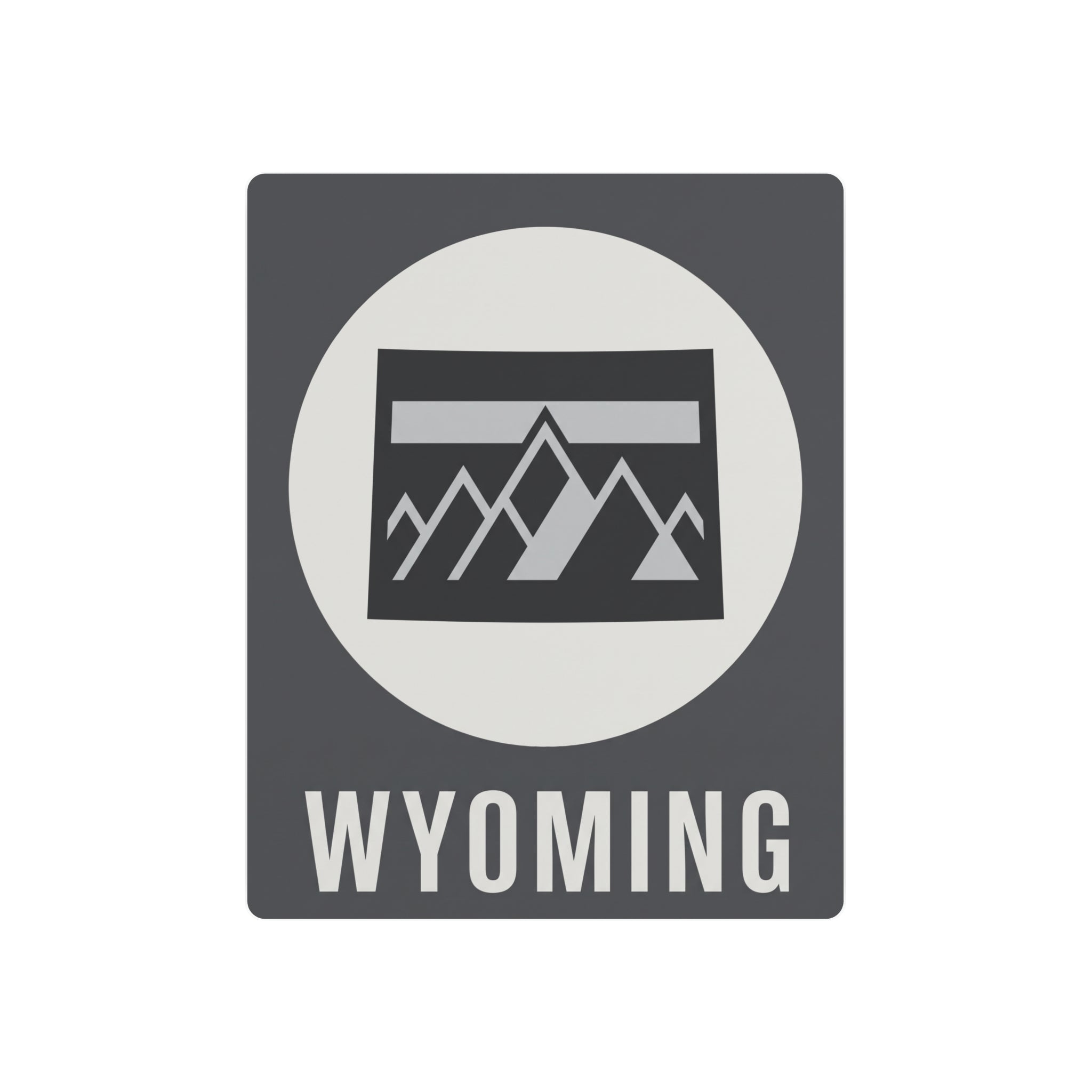 Wyoming metal wall sign with dark gray background, white circle, mountain graphic, and WYOMING text