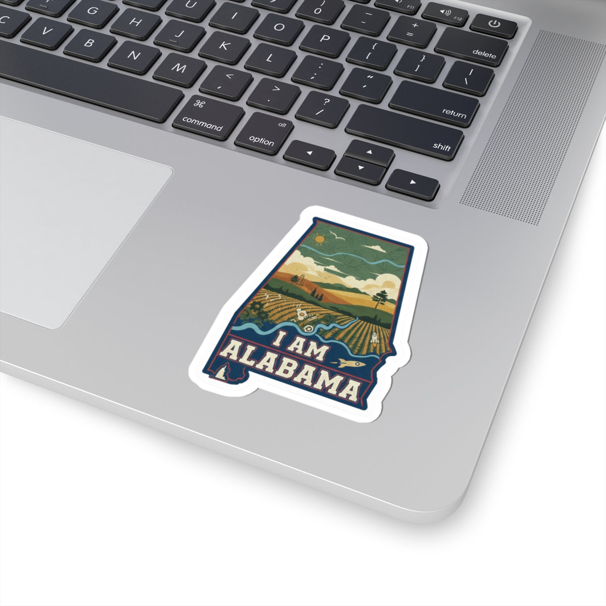 Die-cut I AM ALABAMA sticker on a laptop lid