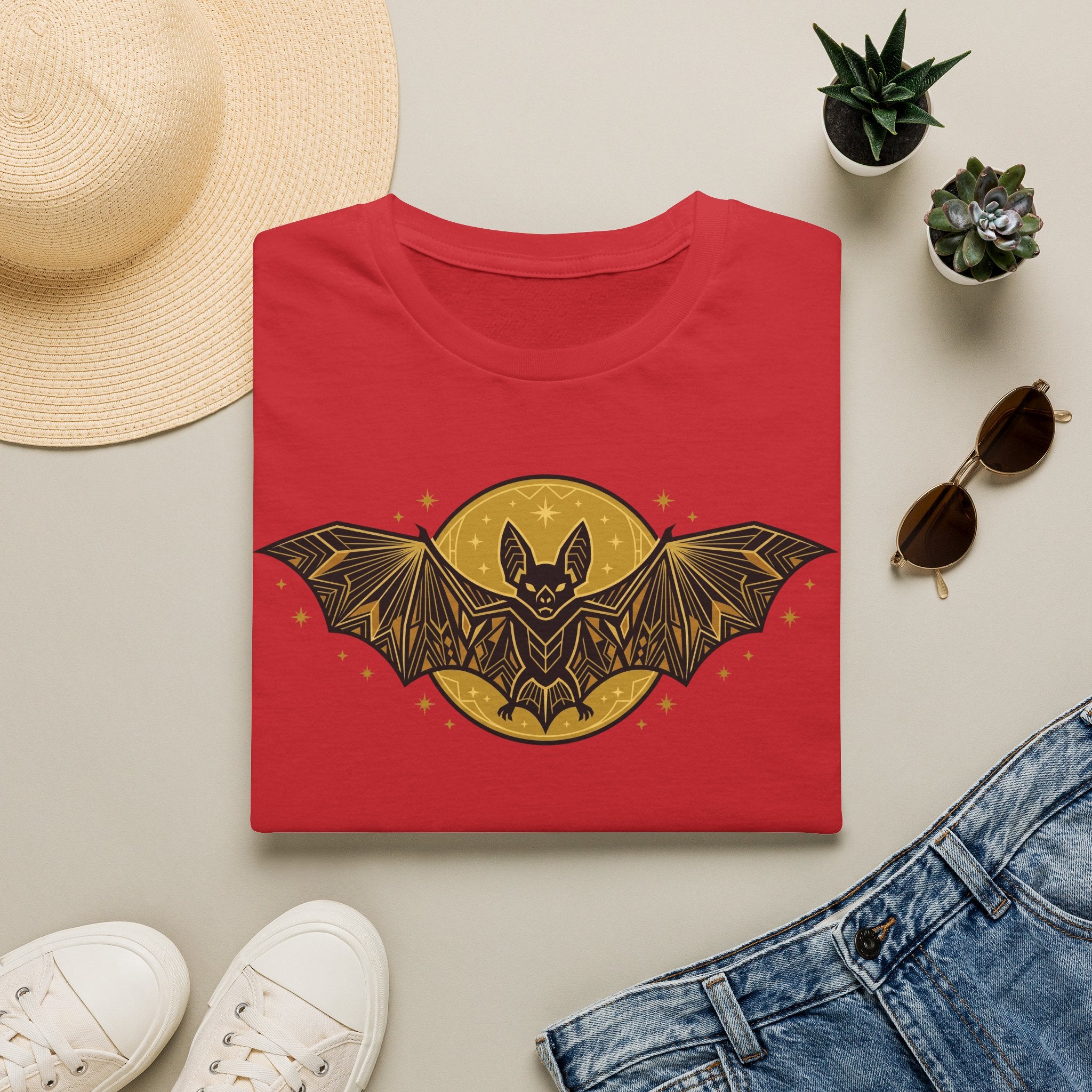 Red crew-neck t-shirt with gold bat-and-moon graphic on the front