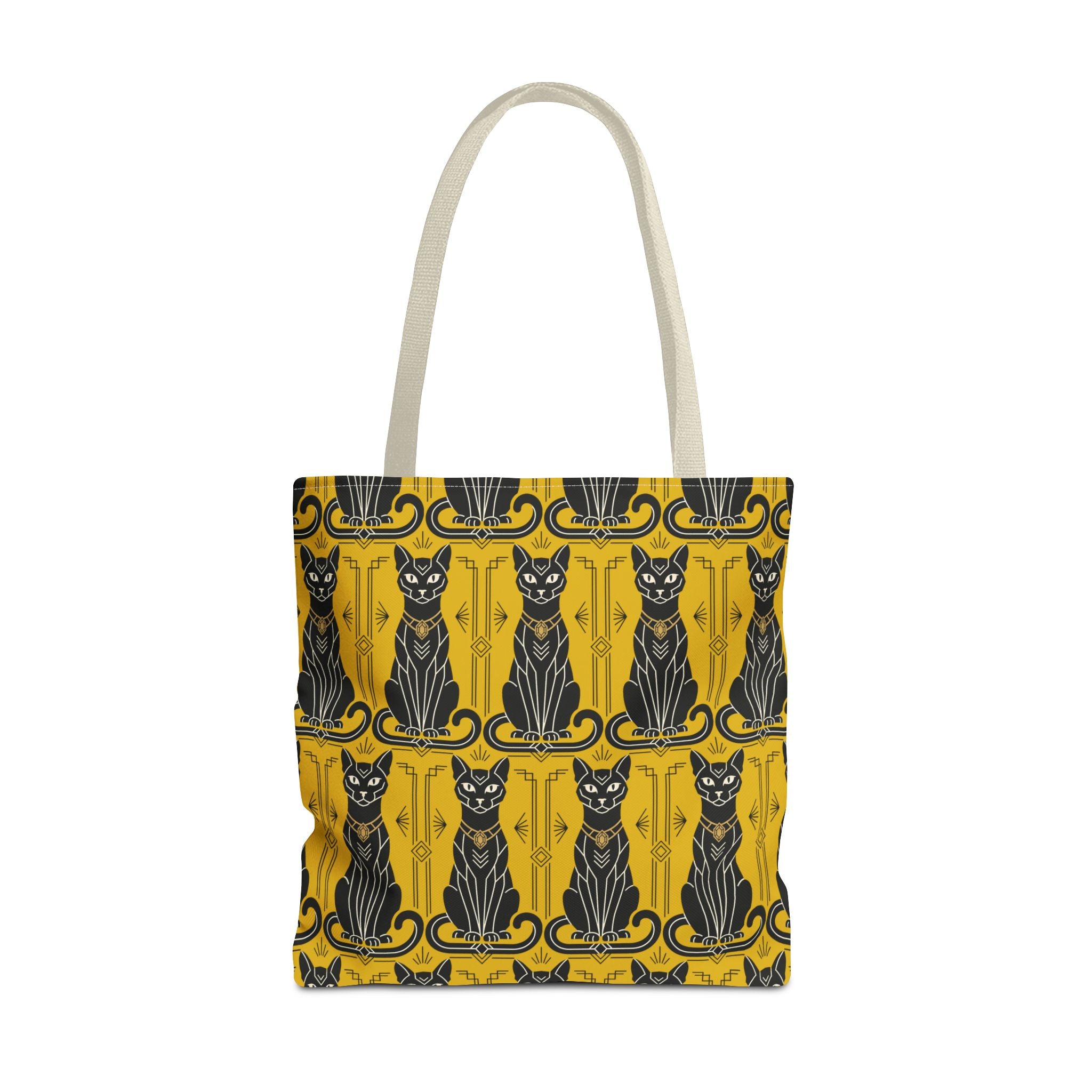 Yellow tote bag with repeating black cat faces and ornate border; beige handles