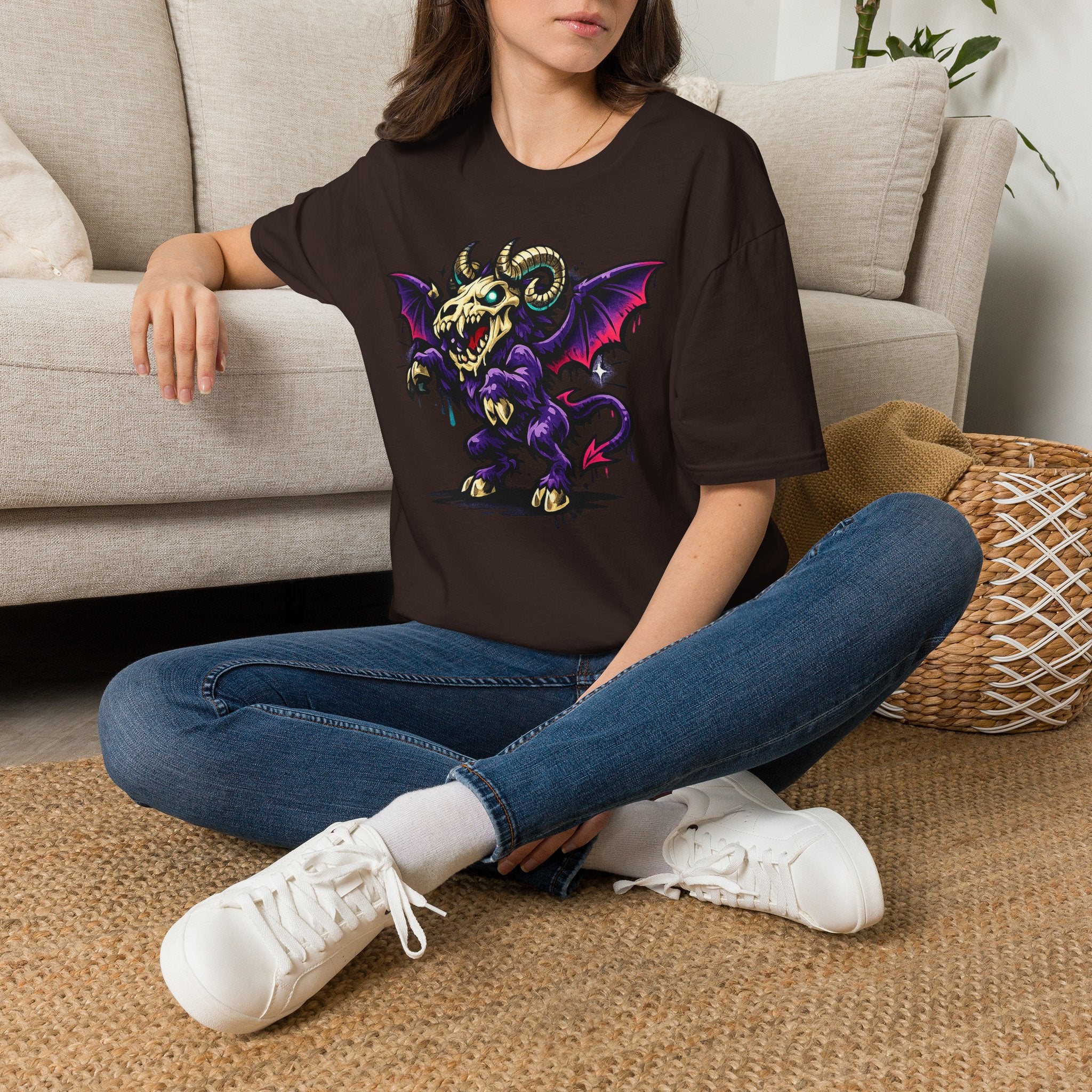 Dark brown graphic T-shirt with purple bat-skull ram creature