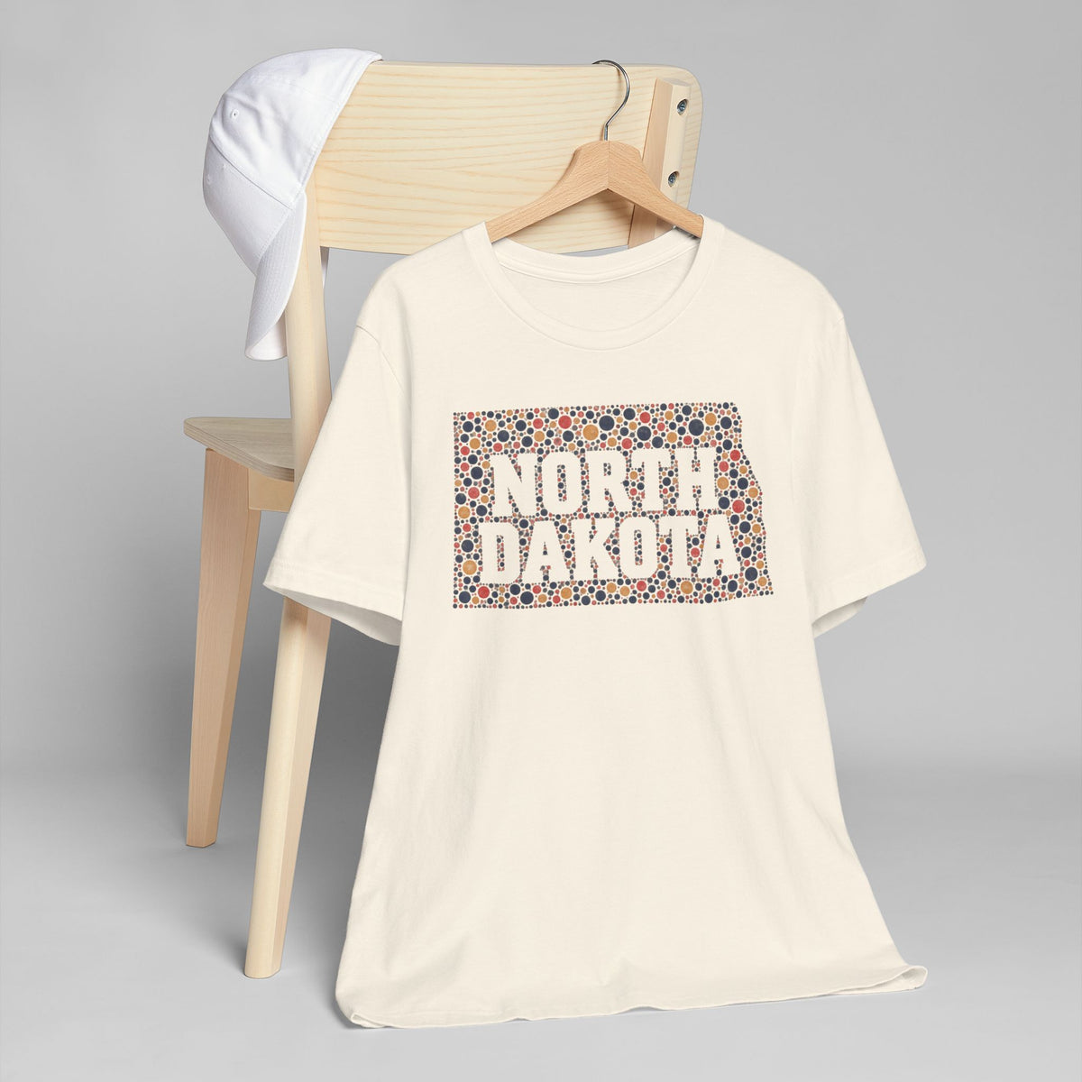 Cream graphic t-shirt with colorful North Dakota floral map front print