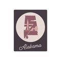 Metal wall art sign with mauve Alabama state silhouette in oval and “Alabama” text