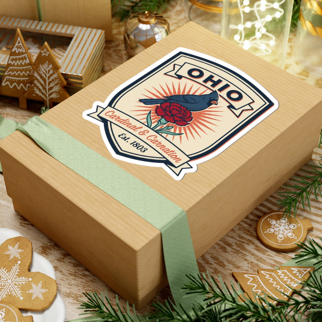 Ohio sticker badge on kraft gift: blue cardinal, red carnation, Est. 1803 ribbon