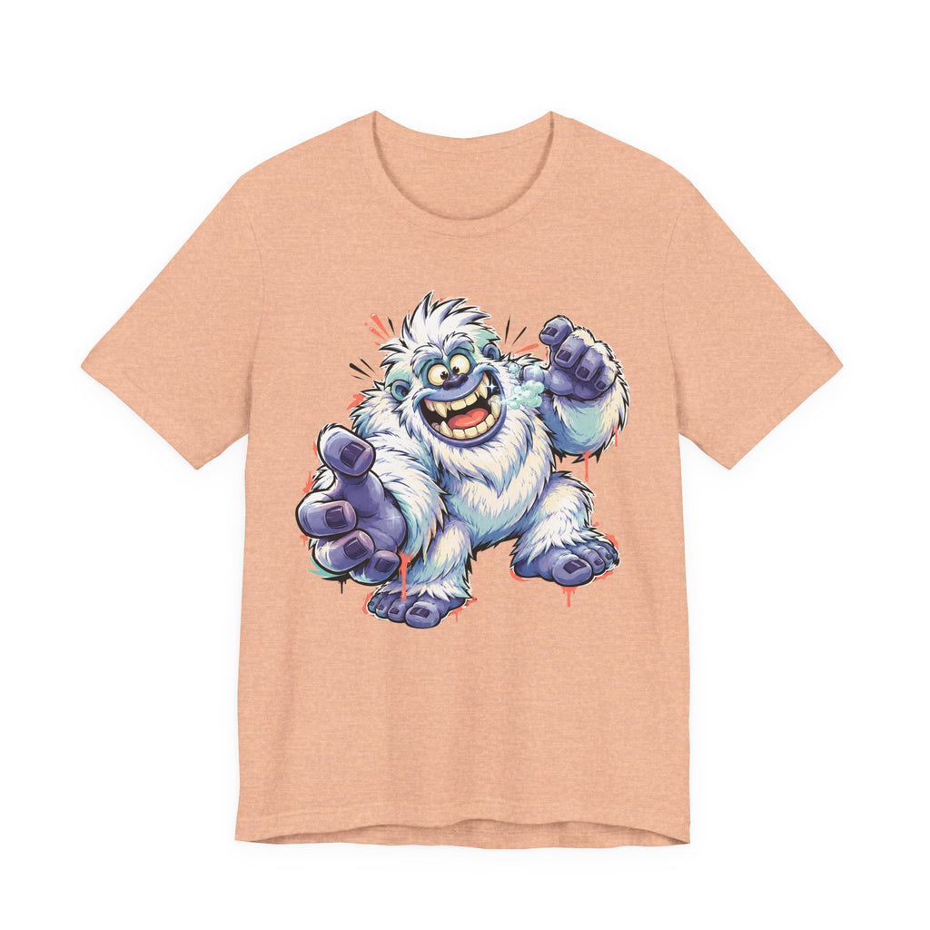 Peach monster t-shirt with cartoon yeti creature graphic waving and grinning